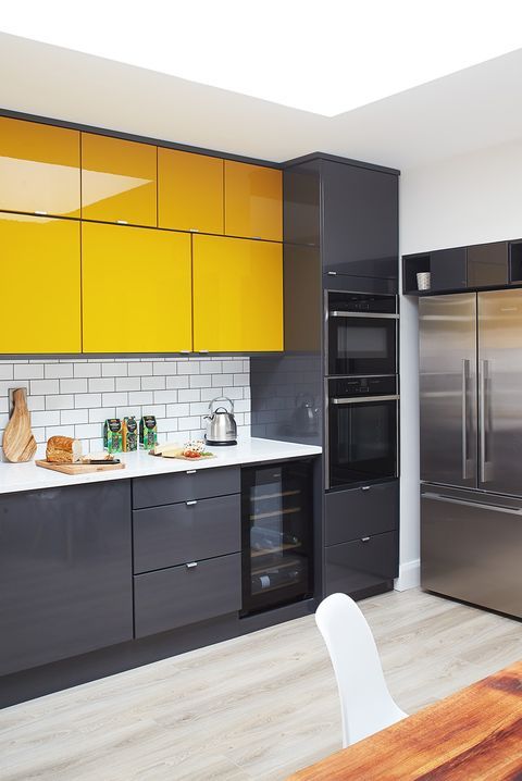 kitchen and living area vinyl wrapped high gloss yellow vinyl and wood JBR Dubai