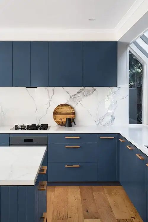 kitchen cabinets and worktop wrapped blue and white vinyl in Springs Dubai